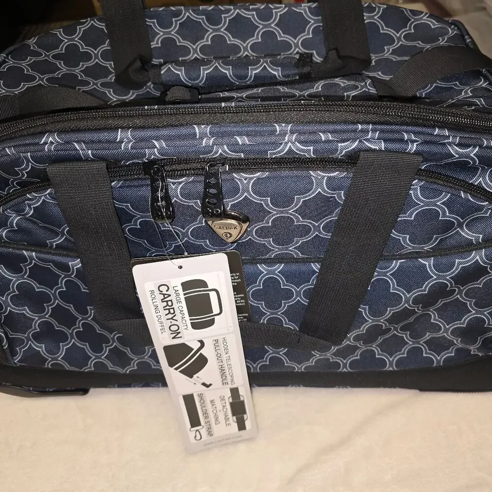 Calpak Plato duffel carry on bag with wheels in BNWT condition.